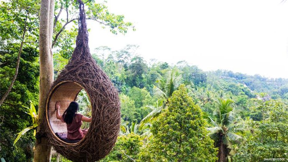 Woman in a nest like swing in Bali Indonesia