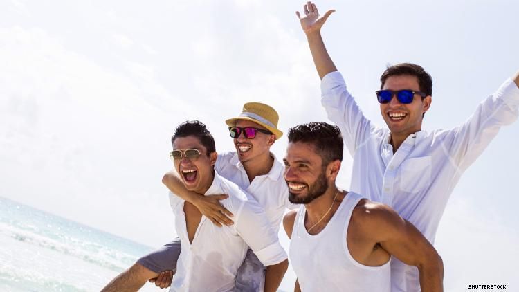 4 gay men on a mexico beach