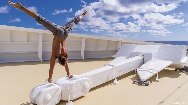A man does upside down splits on a cruise ship