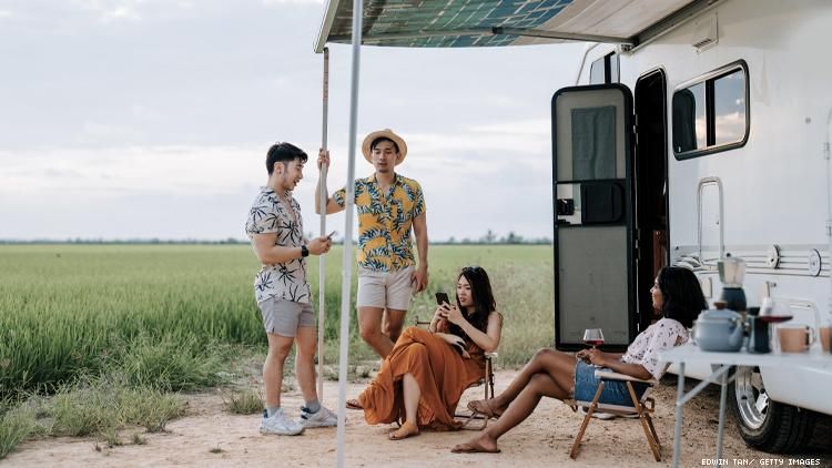 A gay asian couple and lesbian couple share an RV