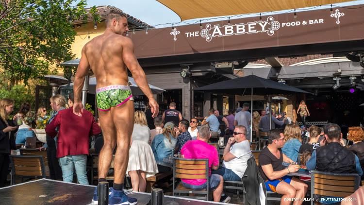 A go-go dancer in front of The Abbey bar in Los Angeles in 2018