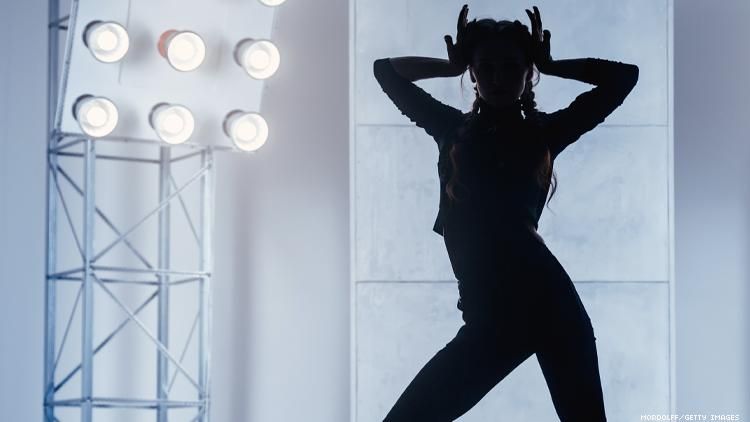 silhouette of woman voguing