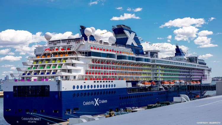 A Celebrity Cruise ship with rainbow flag colors for VACAYA 