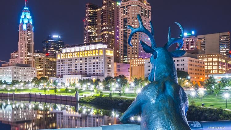 Deer sculpture looking at Columbus Ohio skyline