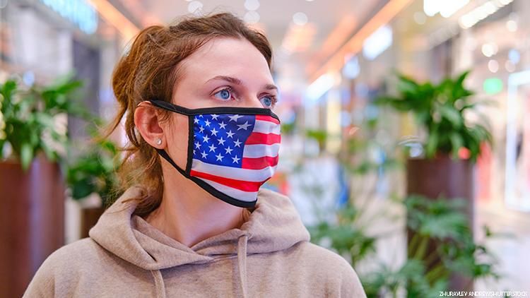 Woman wearing american flag mask