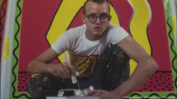 The queer artist Keith Haring painting