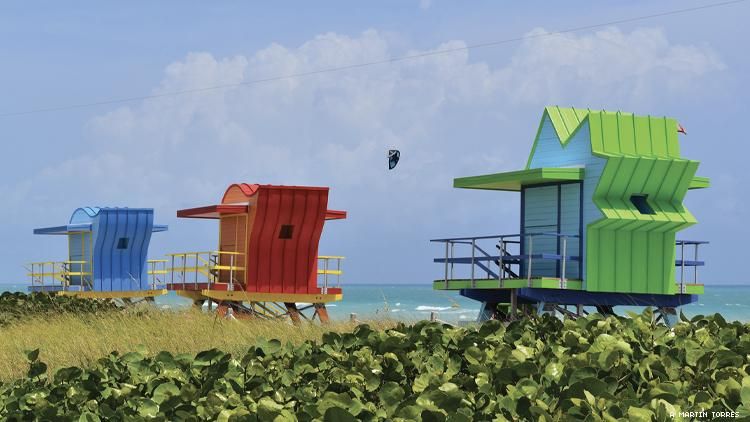 3 colorful lifeguard shacks on Miami Beach