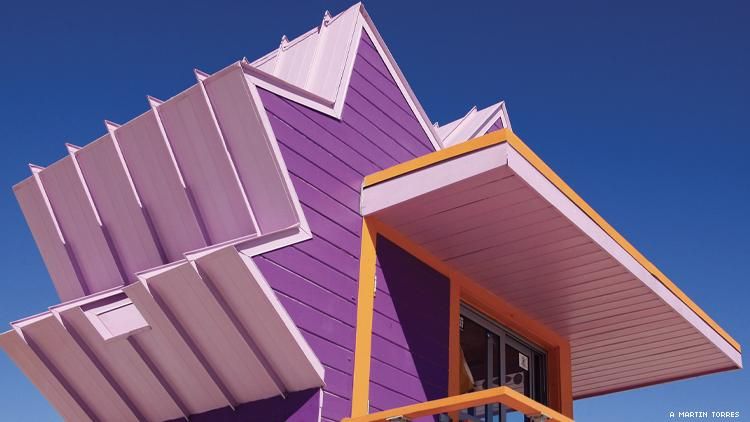 A purple and orange lifeguard shack on Miami Beach