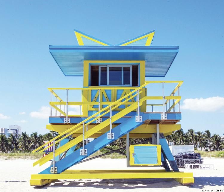A blue and yellow guard shack on Miami Beach