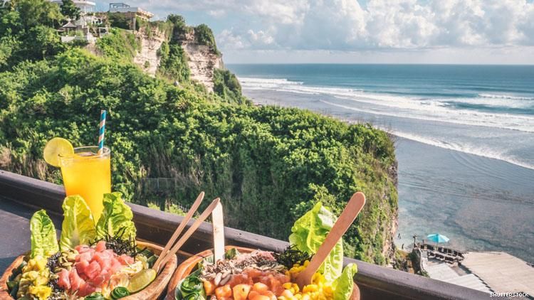 Healthy salads pictured above a cliffside beach