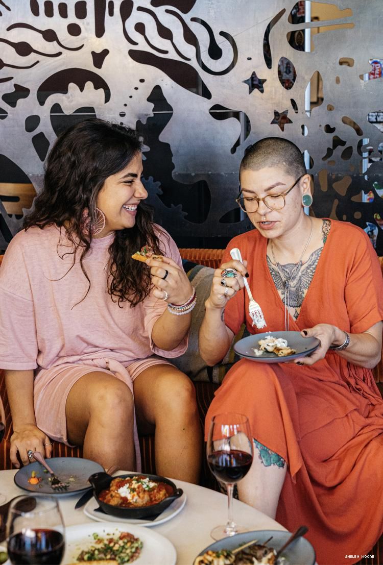 Two women eating at Postino 